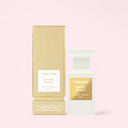 Tom Ford Soleil Blanc Eau de Parfum 50ml perfume bottle and packaging on a light pink background