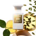 Tom Ford Soleil Blanc Eau de Parfum 50ml perfume bottle with lemon, cardamom pods and leaves on a white background