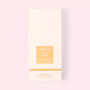 Tom Ford White Suede Eau de Parfum 100ml perfume packaging on a light pink background
