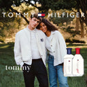 Two people standing outdoors with Tommy Hilfiger branding and perfume bottles.
