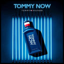 Tommy Hilfiger Tommy Now Eau de Toilette 100ml perfume bottle on a dark background with blue lighting