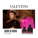 Valentino 'Born in Roma Intense' perfume bottles with Anwar Hadid and model in a luxurious setting