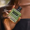 Hand holding a Valentino Donna Born In Roma Green Stravaganza Eau de Parfum 50ml perfume bottle