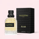 Valentino Uomo Born In Roma Yellow Dream Eau de Toilette 50ml perfume bottle and packaging on a light pink background