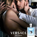 Advertisement for Versace pour homme featuring a couple embracing with a bottle of Versace Pour Homme Eau de Toilette 