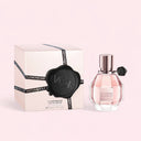 BEAUTE KNOWS Viktor & Rolf Flowerbomb Eau de Parfum 50ml perfume bottle and packaging on a light pink background