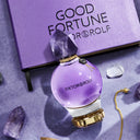 Viktor & Rolf Good Fortune Eau de Parfum 50ml perfume bottle with crystals and packaging on a textured surface
