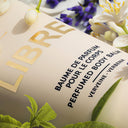 Close up of YSL Yves Saint Laurent Libre Perfumed Body Balm 200ml packaging with floral elements