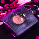 YSL Yves Saint Laurent Black Opium Eau de Parfum 50ml perfume bottle with pink and purple lighting
