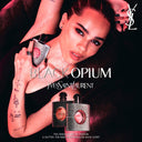Advertisement for Yves Saint Laurent Black Opium perfume with Zoë Kravitz holding the product.