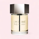 YSL Yves Saint Laurent L'Homme Eau de Toilette 100ml perfume bottle on a light pink background