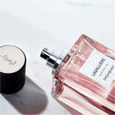 Yves Saint Laurent Lavallière Eau de Parfum 125ml perfume bottle showcasing spray nozzle with black cap on a light background