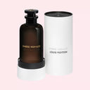 BEAUTE KNOWS Louis Vuitton Ombre Nomade Eau de Parfum in a dark glass bottle with its white cylindrical presentation case.