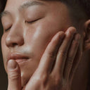BEAUTE KNOWS model applying Aesop B & Tea Balancing Toner to face for hydrated, balanced skin