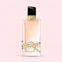 BEAUTE KNOWS Yves Saint Laurent Libre Eau de Toilette 90ml bottle with gold YSL logo and black cap on pink background