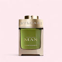 Bulgari Man Miniature Wood Essence perfume bottle on a light pink background
