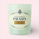 light green Prada Infusion De Vanille Candle 165g on a light pink background