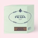Prada Infusion De Vanille Candle 165g packaging on a light pink background