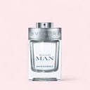 Bulgari Man Miniature Rain Essence perfume bottle on a light pink background